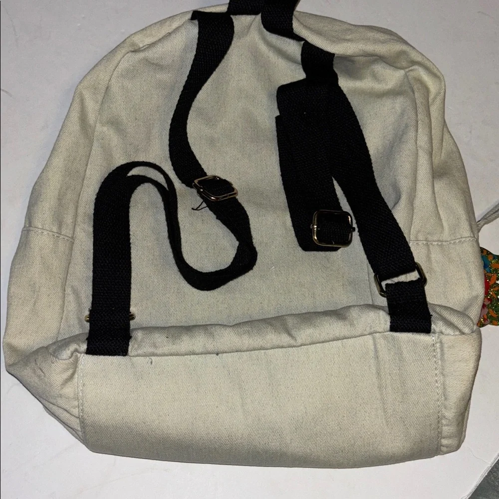 ATMOSPHERE BRAND OFF WHITE DENIM BACKPACK WITH BUTTERFLY PATCH DESIGN   PRELOVED